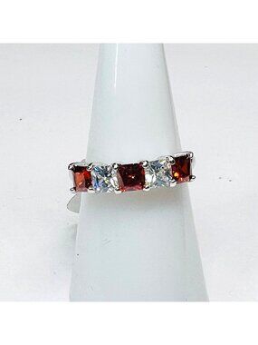 Ring Bomb Party Ring, NWOT, Size 7, red and clear gemstones silver color band